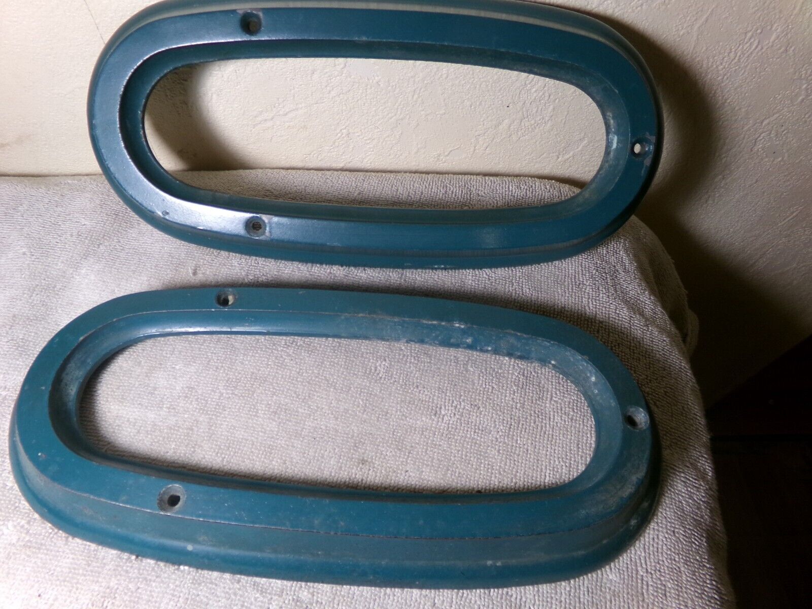 Pair of taillight bezels, L and R, fit 1950 Studebaker Champion, Commander