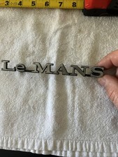 PONTIAC LE MANS EMBLEM  BADGE SCRIPT TRIM   VINTAGE METAL picture