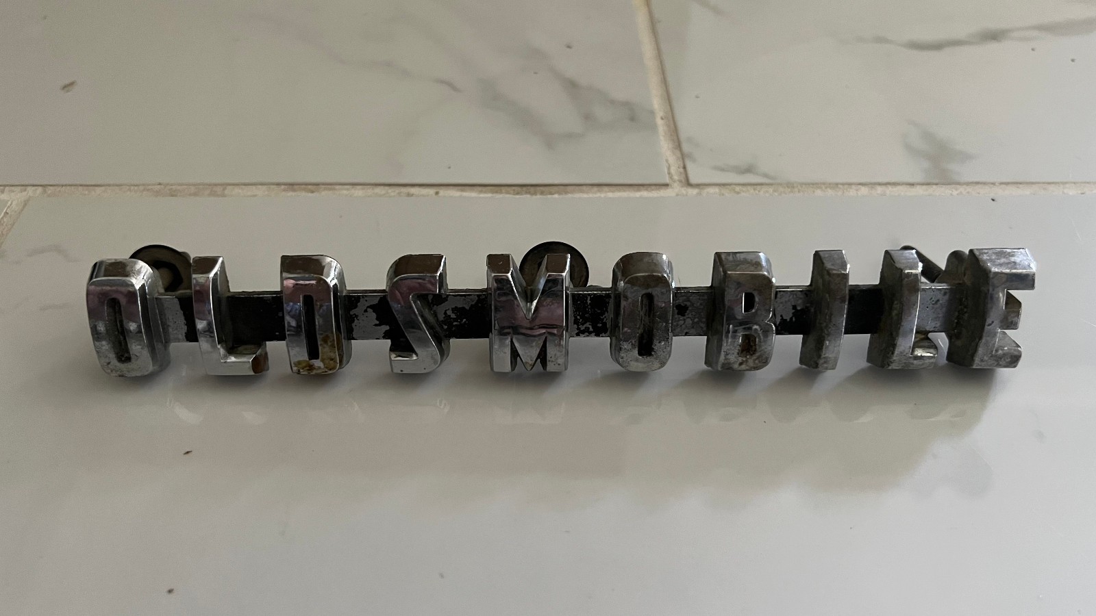 1956 Oldsmobile Front Grille Emblem Badge Letter Bar OEM 567408 88 98 Super
