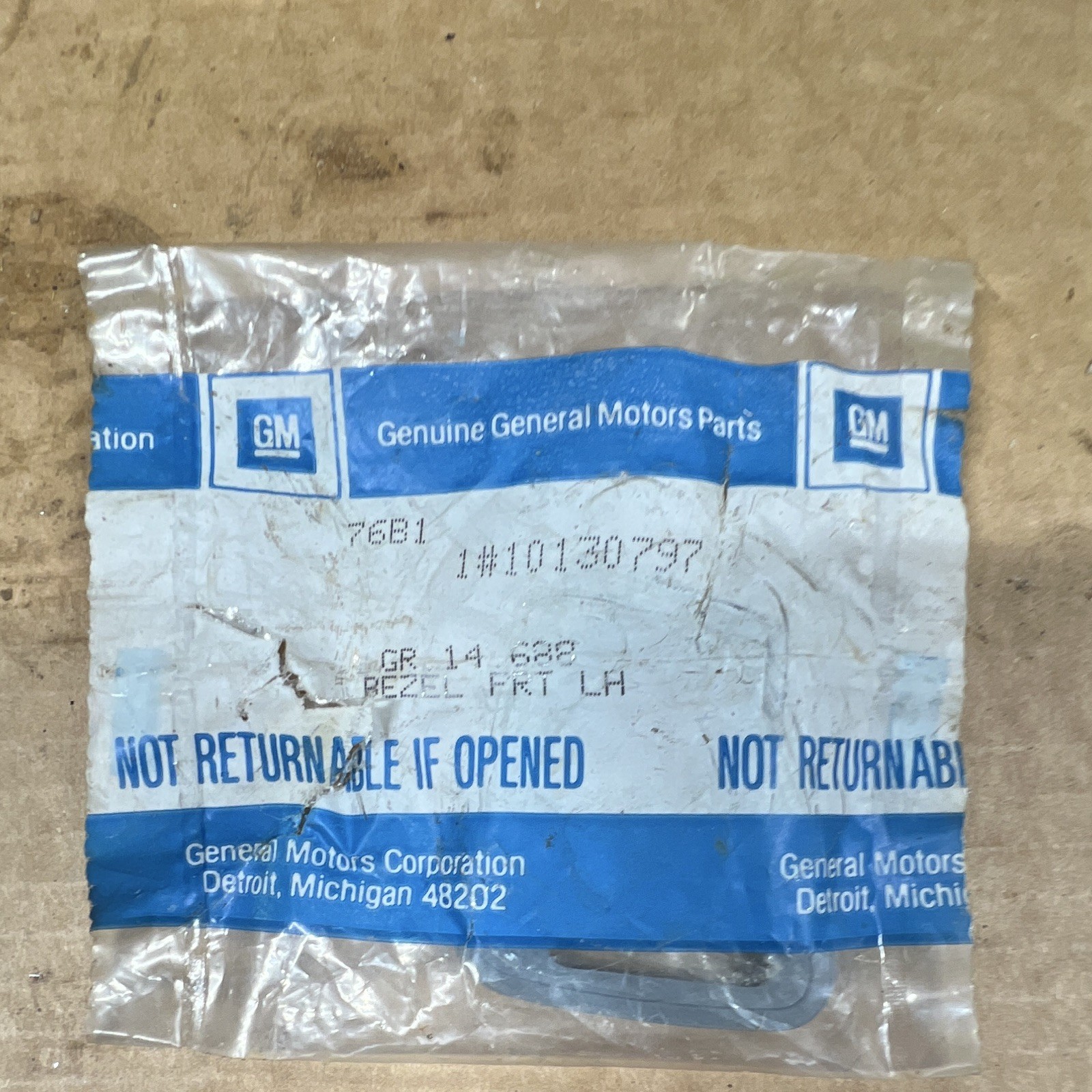 87-90 Chevrolet Beretta/Corsica NOS #10130797 Front LH Bezel Open Package