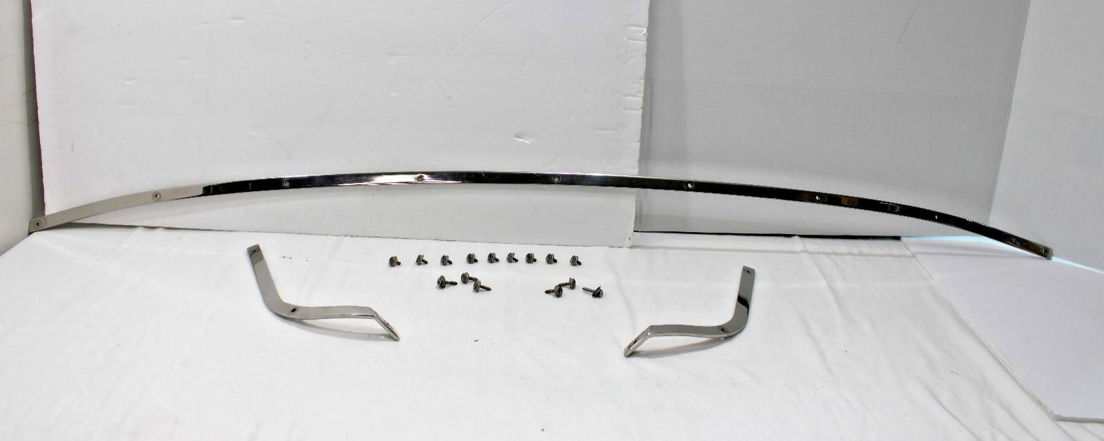 1986 CADILLAC CIMARRON TRUNK LOWER REAR WINDSHIELD EXTERIOR CHROME TRIM-HARDWARE